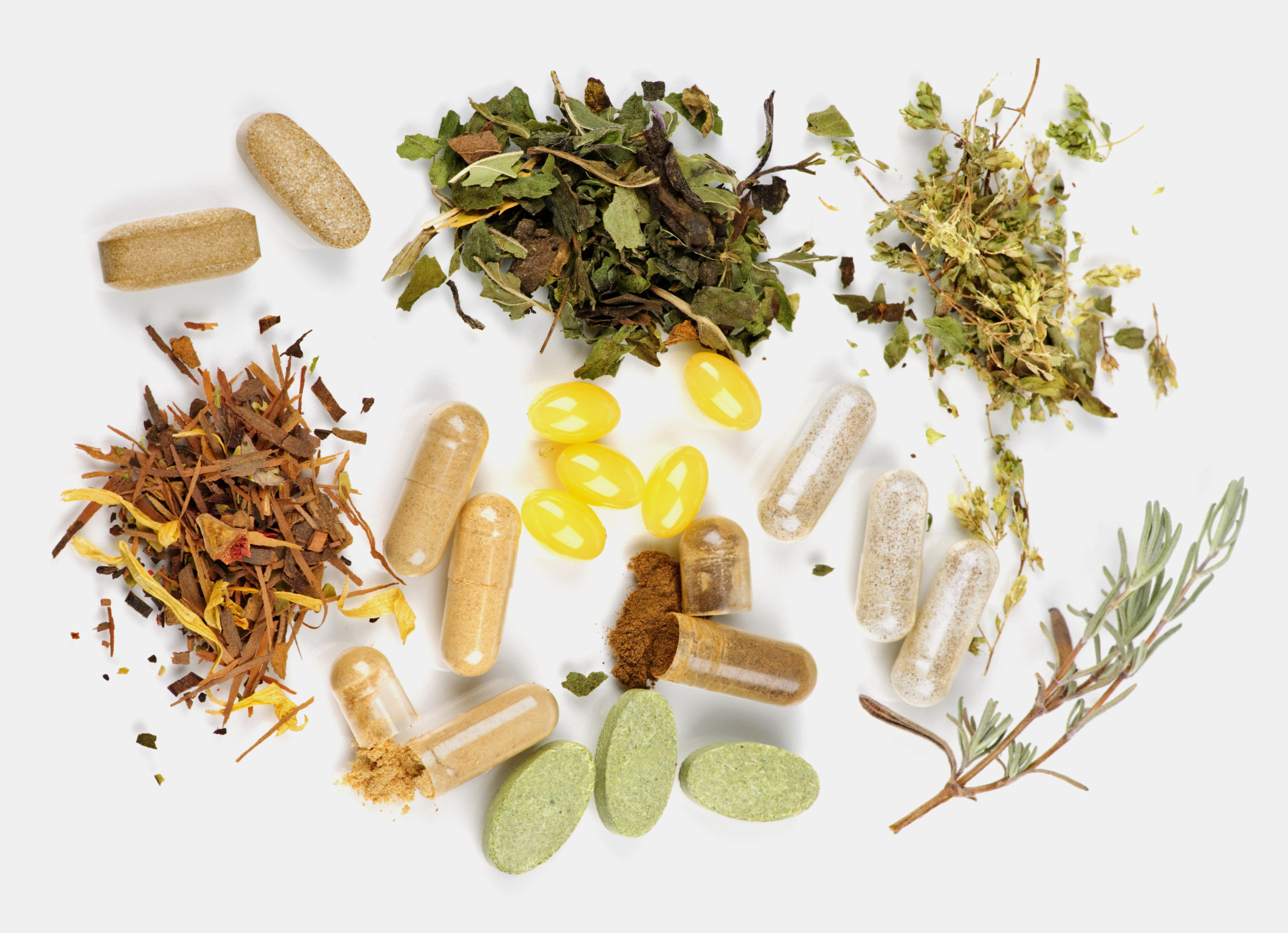 Herbs and pills separated into piles